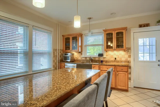 a view of a bedroom with window and furniture