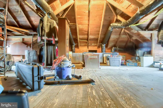 a bed room with a bed and a chandelier