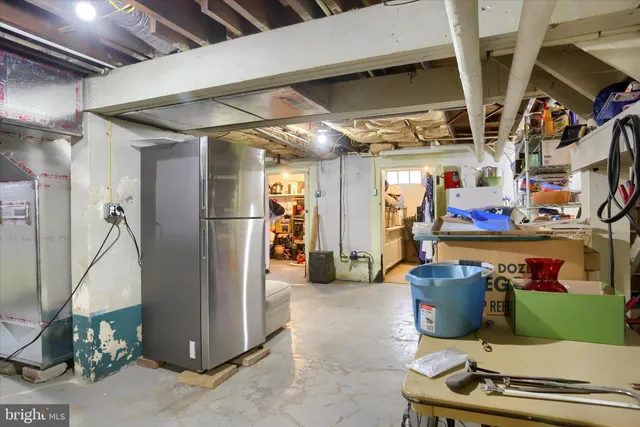 a view of a patio with couches and a fire pit