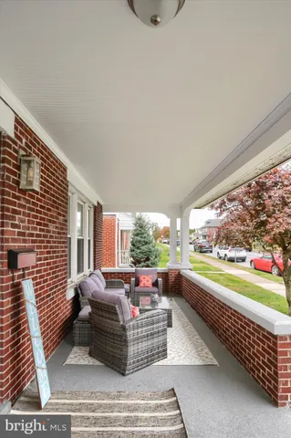 a room with furniture and a large window