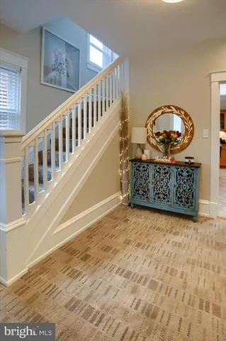 a view of staircase with wooden floor