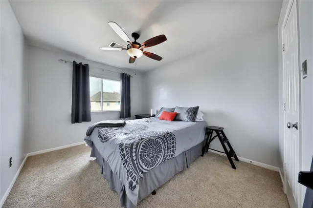 a bedroom with a bed and window