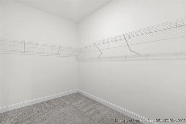 a white bath tub sitting next to a window