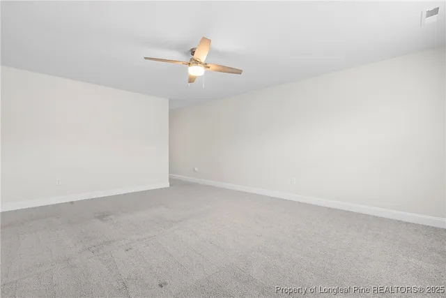 a view of a lake with houses in the background