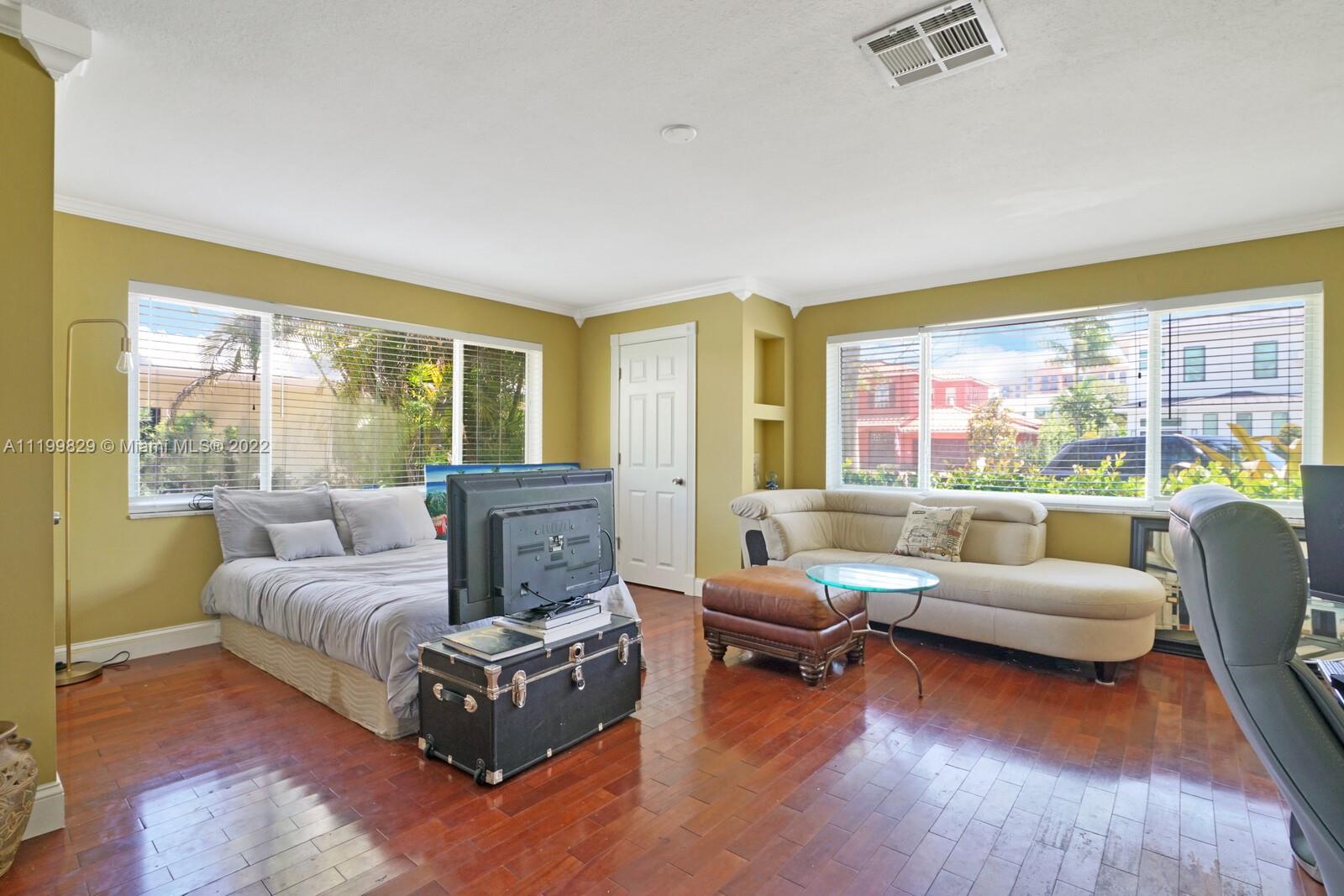 365 Northeast 3rd Street Boca Raton, FL 33432 - Photo 14 of 25 a living room with furniture and a large window