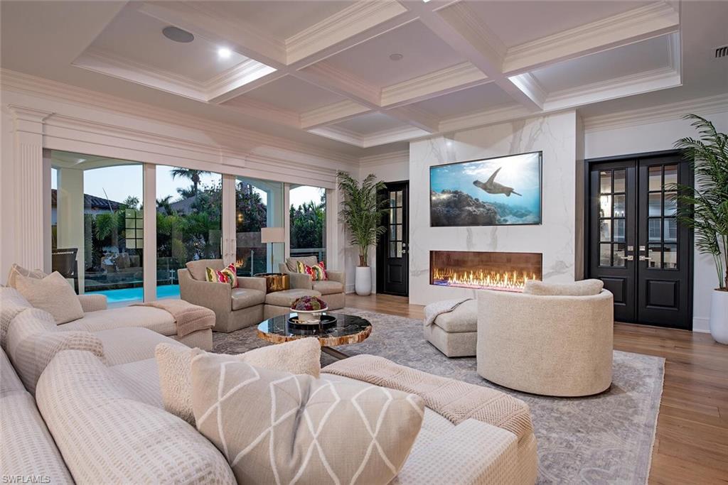 140 3rd Avenue South Naples, FL 34102 - Photo 5 of 46 a living room with furniture and a flat screen tv