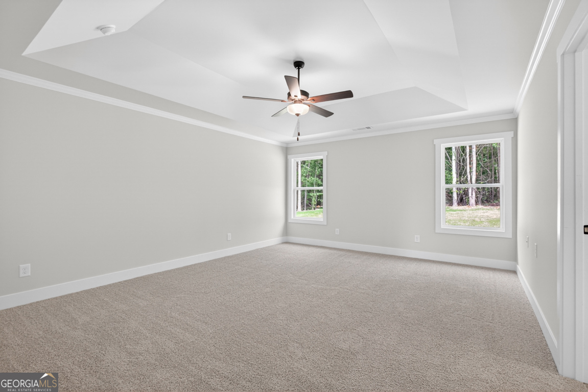 206 Airport Road, Unit 11 Canon, GA 30520 - Photo 21 of 34 an empty room with windows and fan