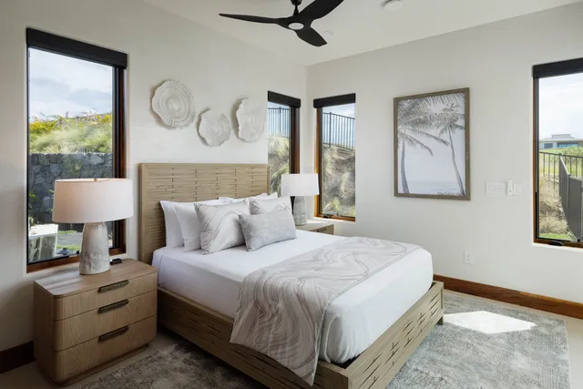 a bedroom with bed and a window