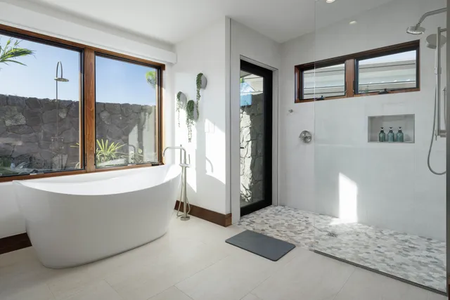 a living room with a large window and a table