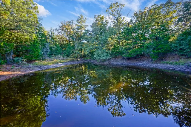 a view of a lake with a yard