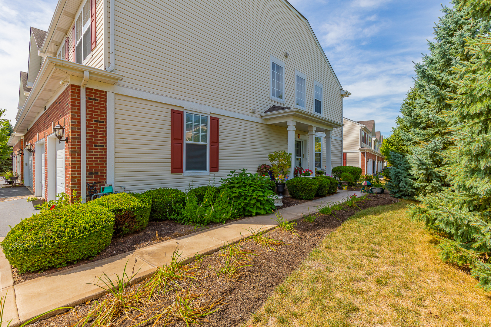 1902 Crestview Circle, Unit 1902 Romeoville, IL 60446 - Photo 3 of 32 a front view of a house with garden