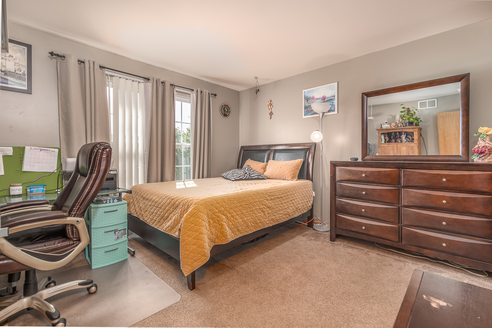 1902 Crestview Circle, Unit 1902 Romeoville, IL 60446 - Photo 22 of 32 a bedroom with a bed and a chair