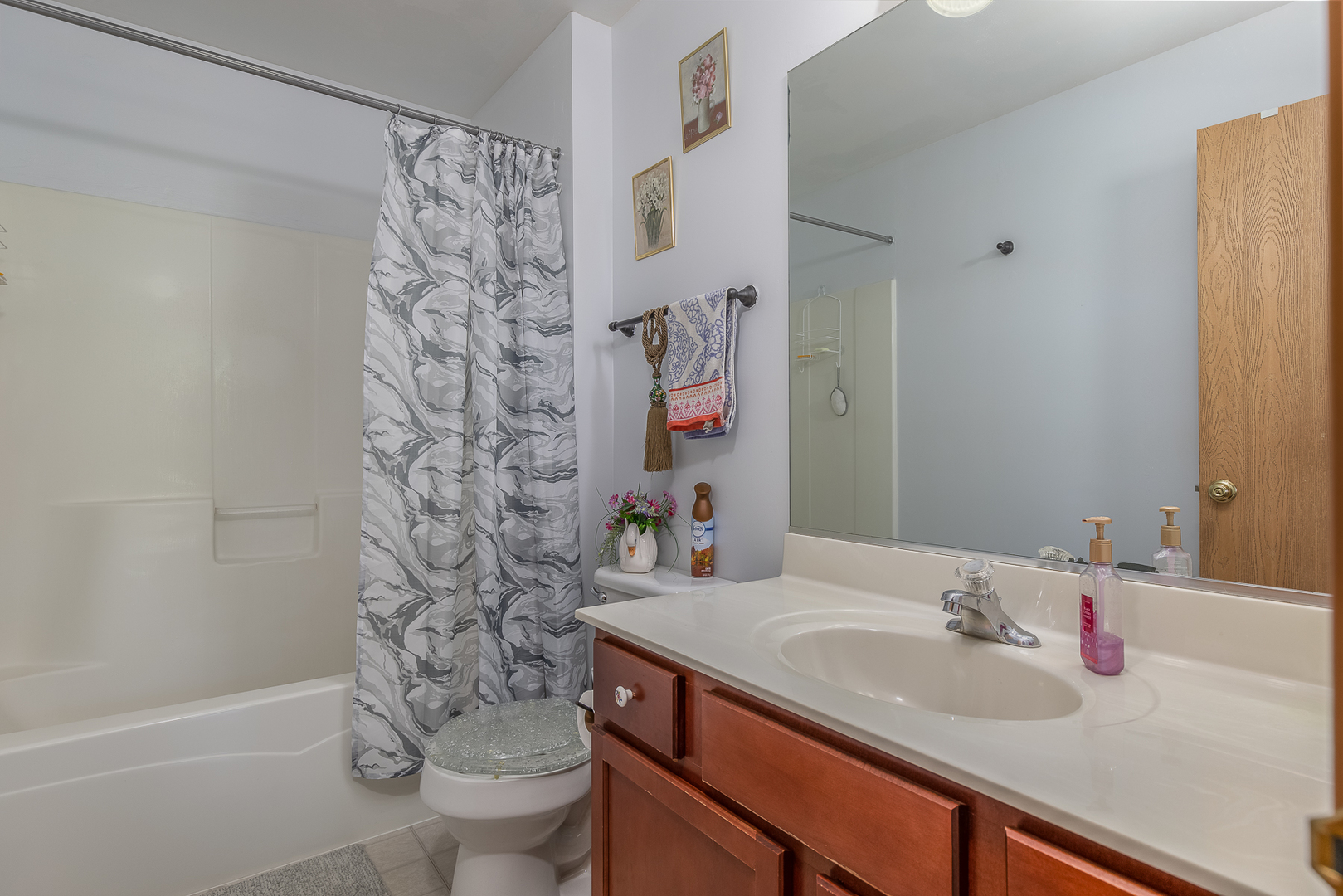 1902 Crestview Circle, Unit 1902 Romeoville, IL 60446 - Photo 24 of 32 a bathroom with a sink toilet and shower