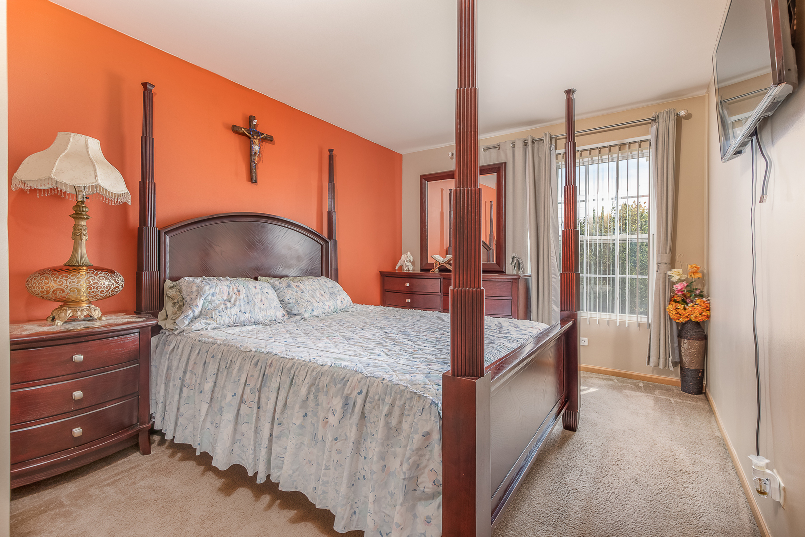 1902 Crestview Circle, Unit 1902 Romeoville, IL 60446 - Photo 25 of 32 a bedroom with a large bed and a chandelier