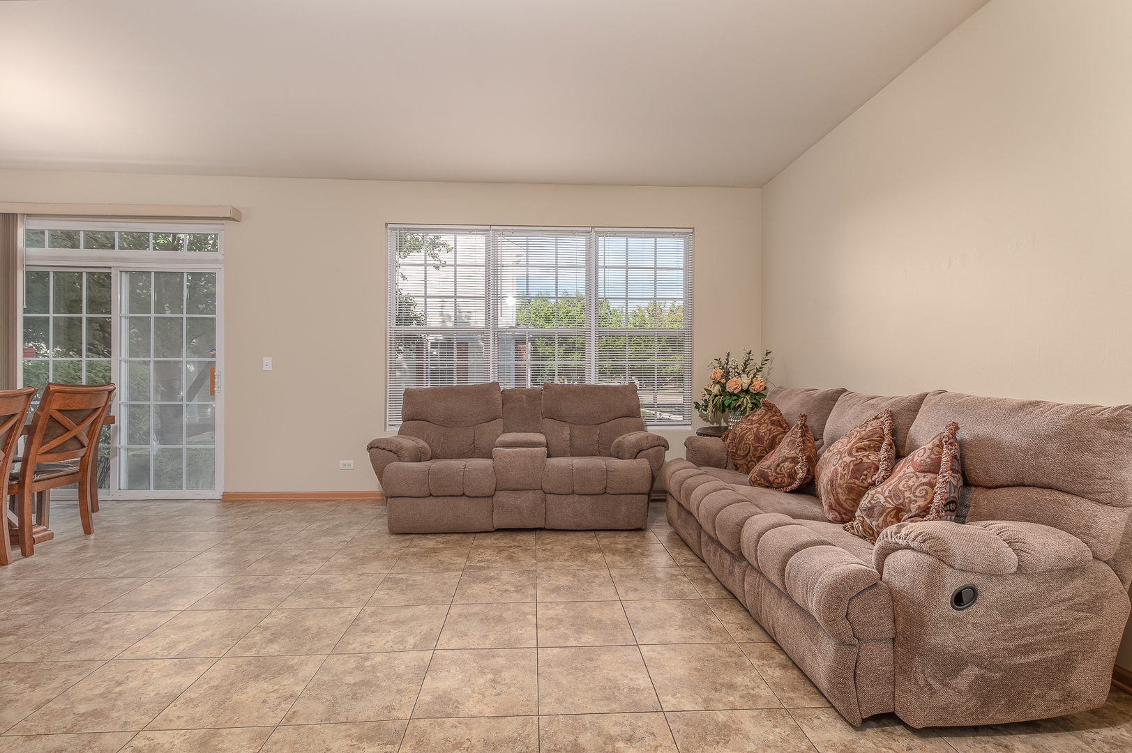 1902 Crestview Circle, Unit 1902 Romeoville, IL 60446 - Photo 9 of 32 a living room with furniture and a large window