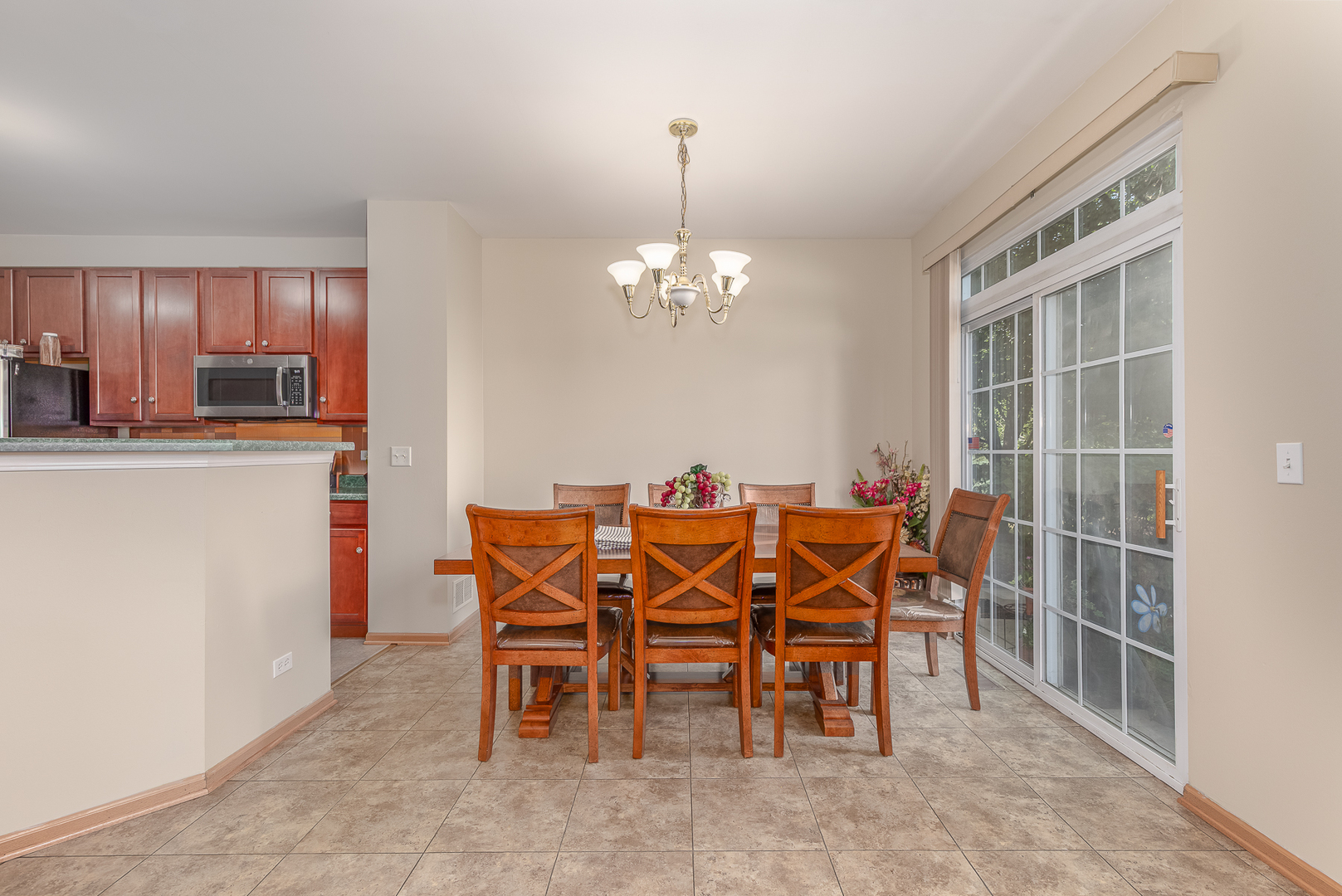 1902 Crestview Circle, Unit 1902 Romeoville, IL 60446 - Photo 10 of 32 a dining room with furniture and chandelier