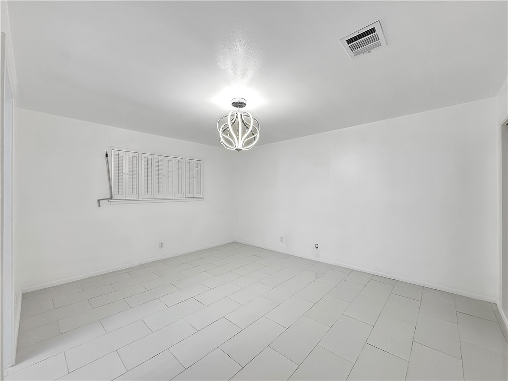 4115 Meridian Place Corpus Christi, TX 78411 - Photo 13 of 24 an empty room with chandelier fan