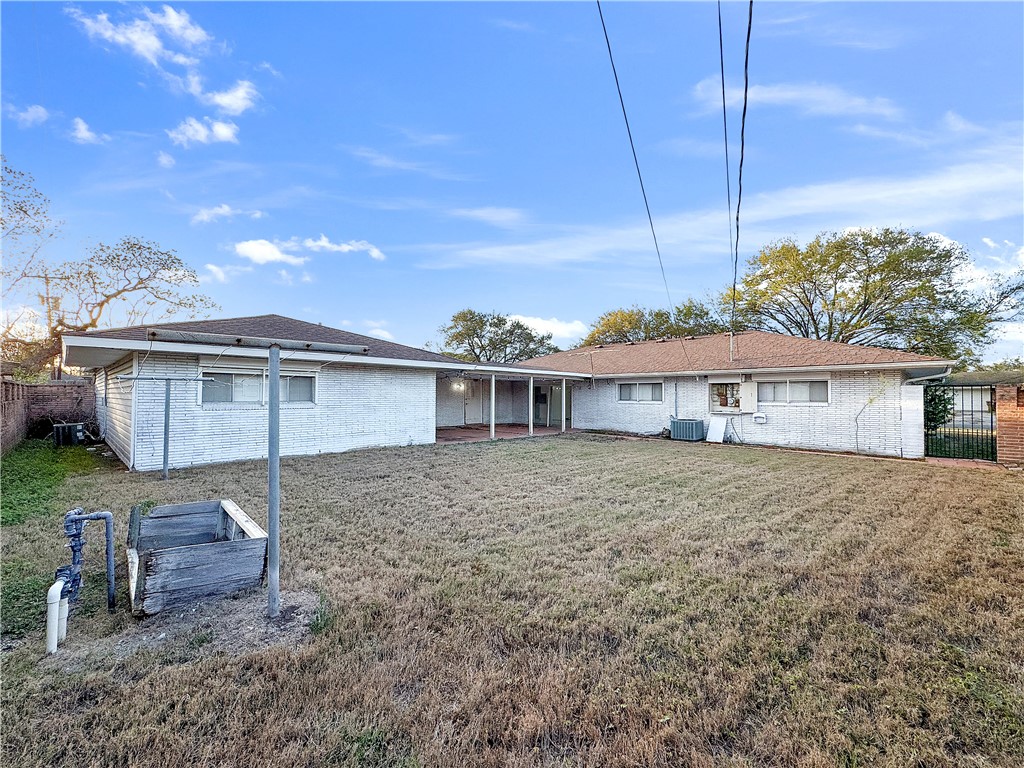 4115 Meridian Place Corpus Christi, TX 78411 - Photo 24 of 24 a front view of a house with a garden
