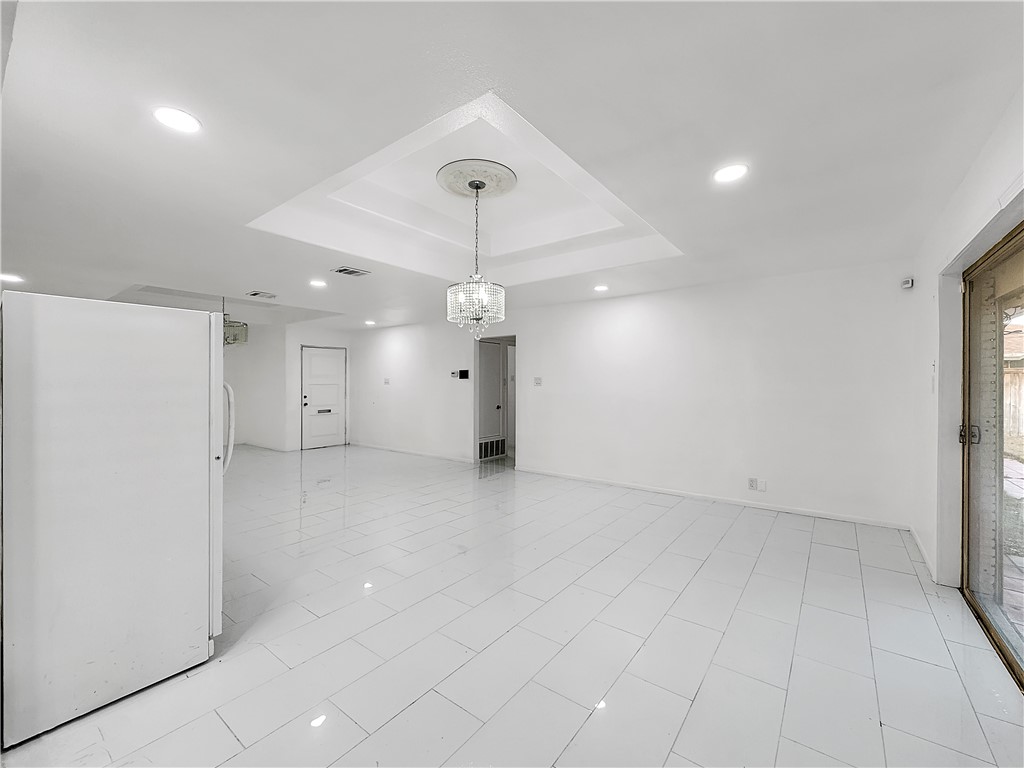 4115 Meridian Place Corpus Christi, TX 78411 - Photo 7 of 24 an empty room with a empty space and a ceiling fan
