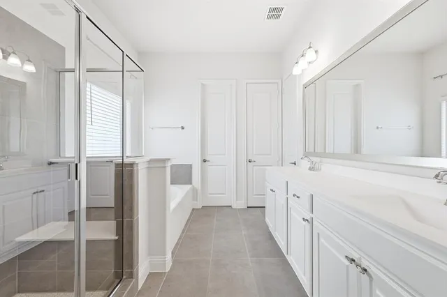 a bathroom with a sink and a shower