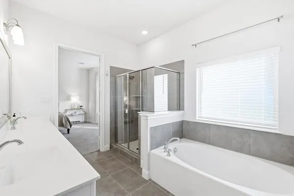 a bathroom with a bathtub and a sink