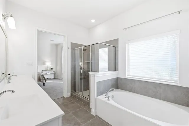 a bathroom with a bathtub and a sink