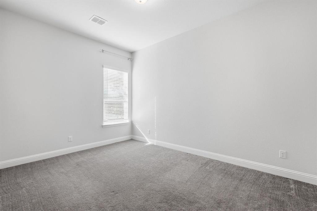 5409 Welsh Street Denton, TX 76226 - Photo 21 of 31 Empty room featuring carpet flooring and baseboards