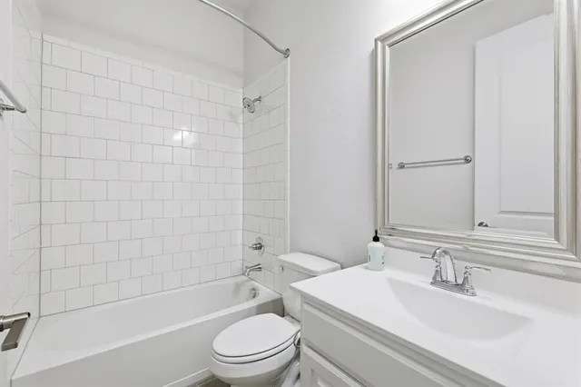 a bathroom with a toilet a sink and a bathtub