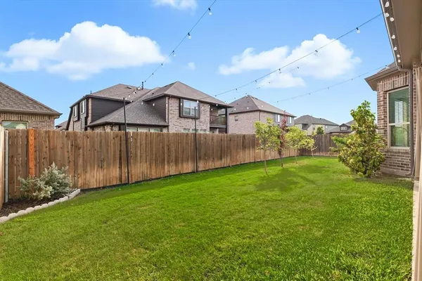 a view of a yard in front of a house