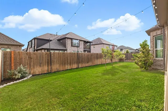 a view of a yard in front of a house