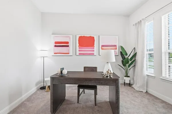 a workspace with furniture and window