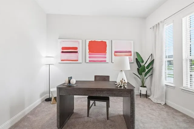 a workspace with furniture and window