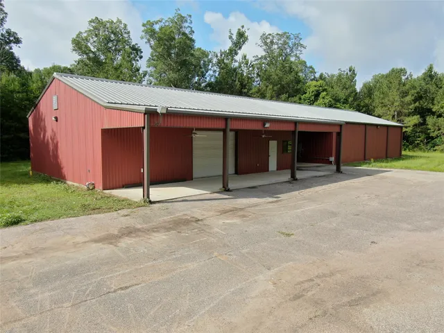 a view of a house with a yard and garage