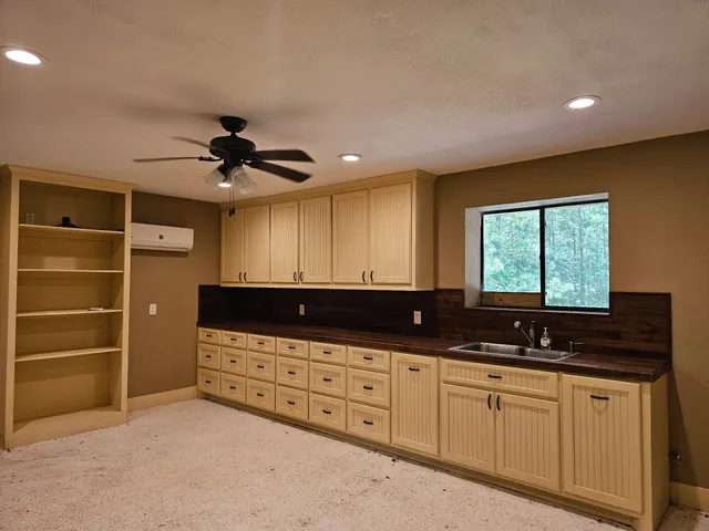 a bathroom with a sink and a window