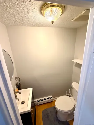 a bathroom with a toilet and a sink