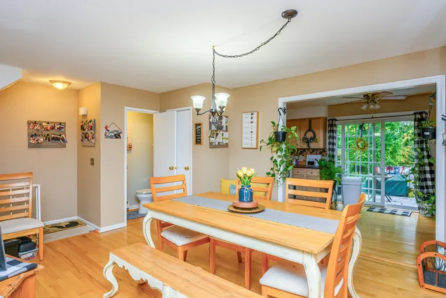 a dining room with a table and chairs