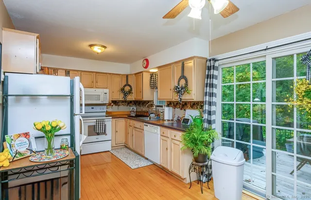 a kitchen with stainless steel appliances a sink a stove and a refrigerator