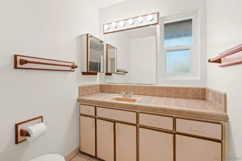a bathroom with a sink and a mirror