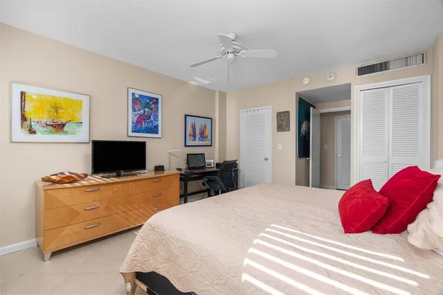 a bedroom with a bed and a desk