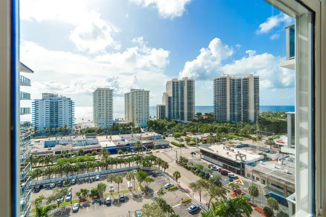 a kitchen with a sink a stove and chairs