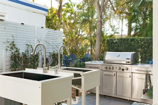 a swimming pool with outdoor seating and yard