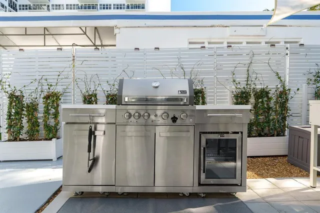 a view of a chairs and table in backyard