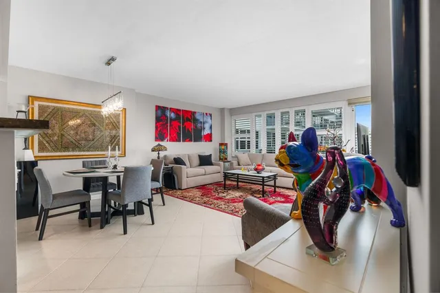 a living room filled with furniture gym equipment and a window