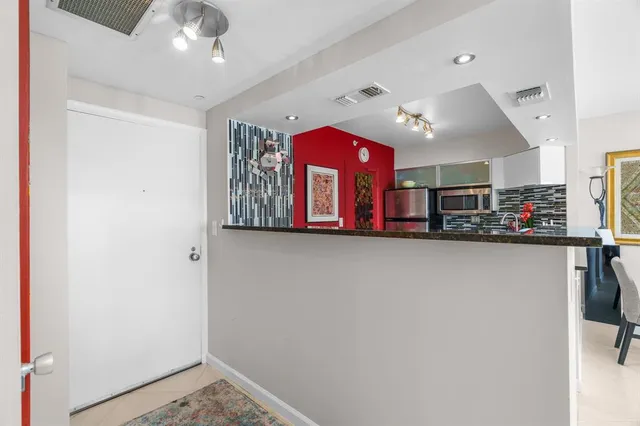 a view of a dining room with furniture and window