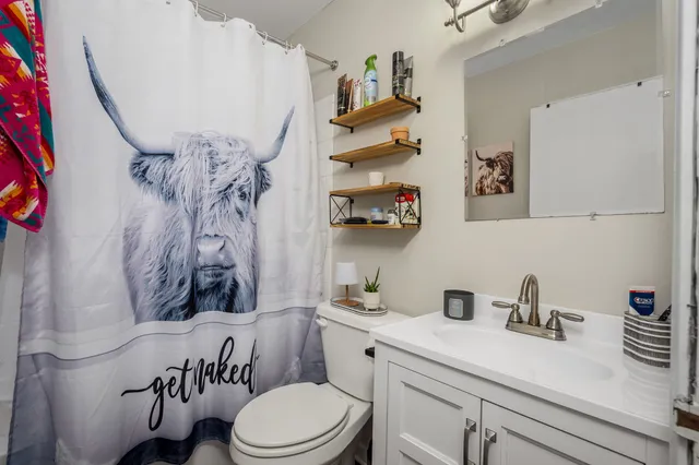 a bedroom with bed and window
