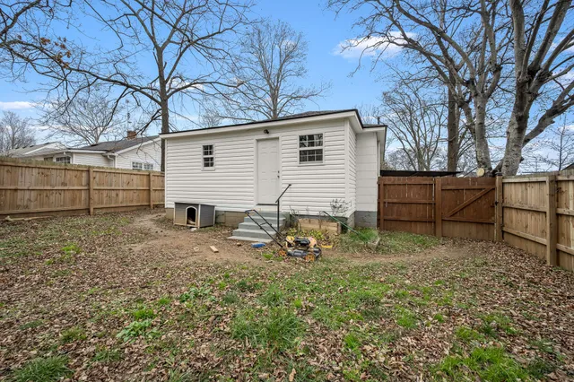 a picture of a bench in front of a wall