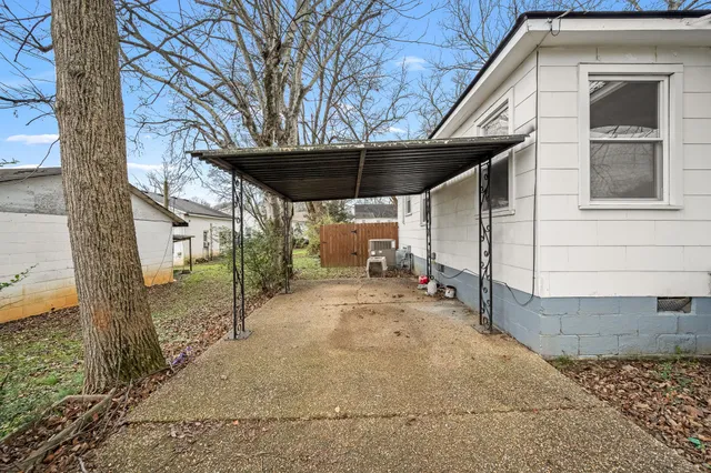 a view of a house with a snow on the road