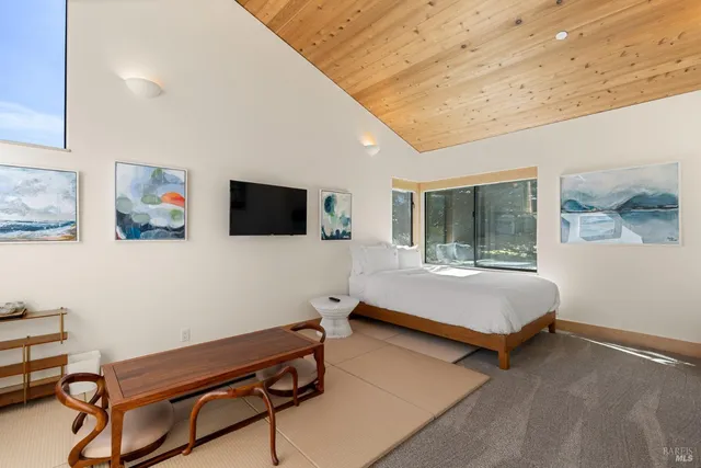 a room with furniture pool table and flat screen tv