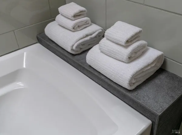 a bathroom with a bathtub and shower