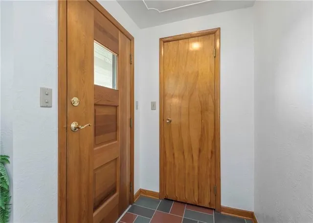a view of a bathroom with a shower and a door